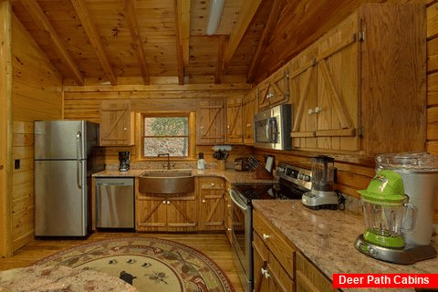 Kitchen with granite counters in 2 bedroom cabin - River Edge