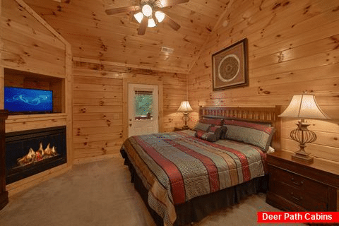 Master Bedroom with Fireplace and King Bed - Smoky Mountain Lodge