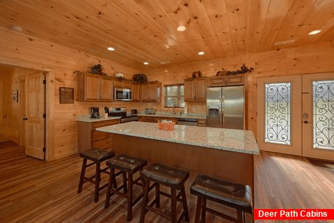 Luxurious kitchen with granite counters in cabin - A River Retreat
