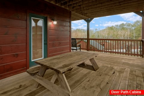 Cabin with picnic table and hot tub on deck - Bear Cove Lodge