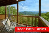 Cabin with porch swing overlooking mountain view
