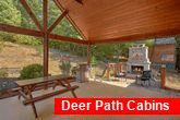 Cabin with outdoor fireplace and picnic table