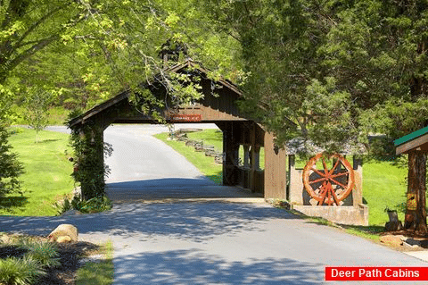 Cabin with Covered Bridge resort entrance - Hillbilly Hideaway