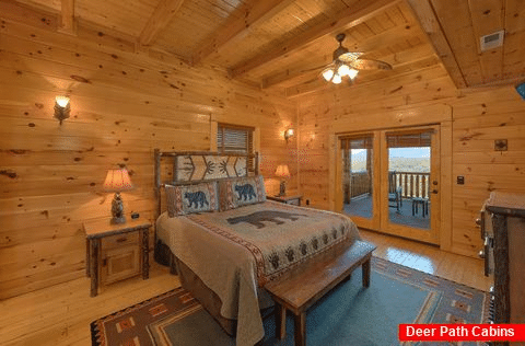King bedroom with private deck access in cabin - Summit View Lodge
