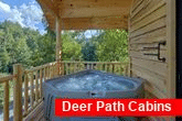 Treehouse cabin rental with hot tub on deck