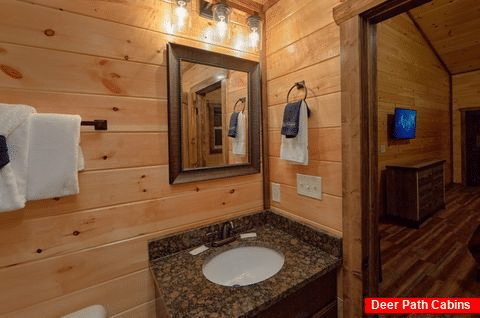 King bedroom with bath in 3 bedroom cabin rental - Smoky Bear Lodge