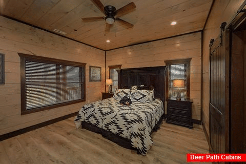 Main Level Master Bedroom in 15 bedroom cabin - Smoky Mountain Masterpiece