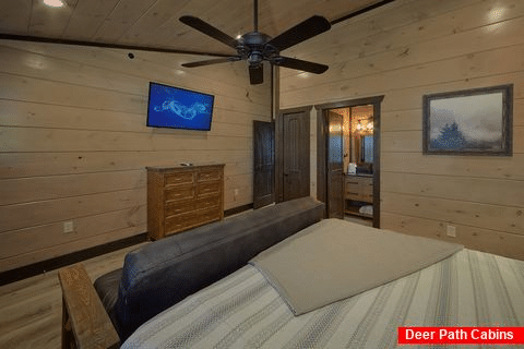 Private Bath, Futon and TV in King cabin bedroom - Smoky Mountain Masterpiece