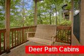 1 bedroom cabin with porch swing and hot tub