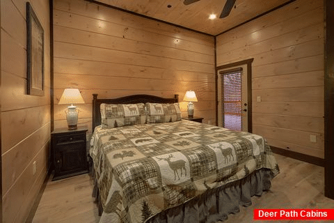 Rental cabin master bedroom with private deck - Smoky Mountain Masterpiece
