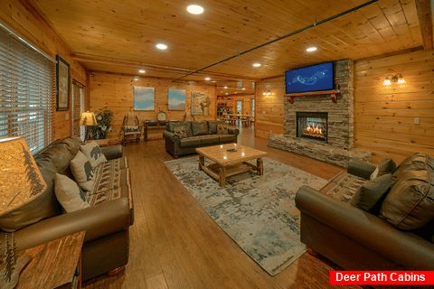 Living room with fireplace in 11 bedroom cabin - The Big Lebowski