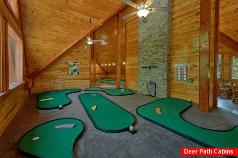 Luxury cabin rental with indoor putt putt course - The Big Lebowski