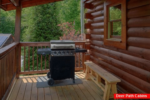 Resort cabin with grill and rocking chairs - Cozy Escape