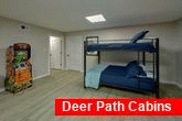 Cabin game room with Shuffleboard and bunk beds