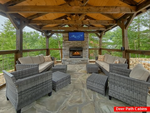 Outdoor fireplace and TV at 3 bedroom cabin - A Peaceful Haven