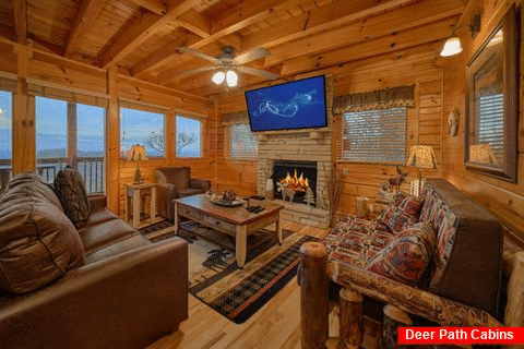 Living room with fireplace in 2 bedroom cabin - Chocolate Moose