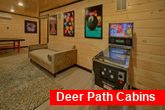 Cabin game room with pin ball game and arcades