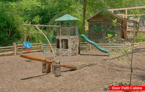 Playground for kids at Cabin Resort on the River - River Mist Lodge